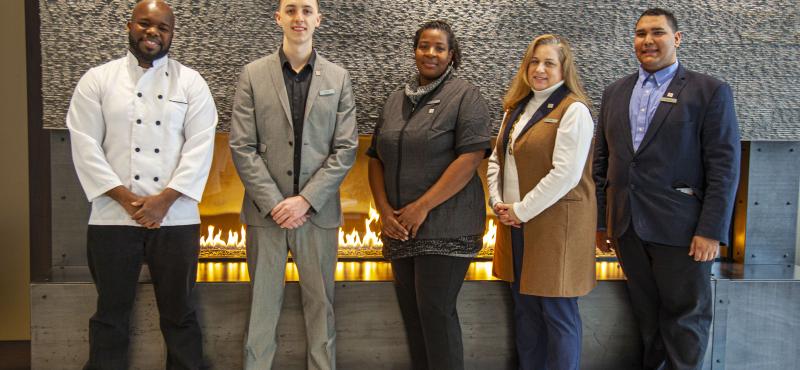 Various hotel staff in a hotel lobby