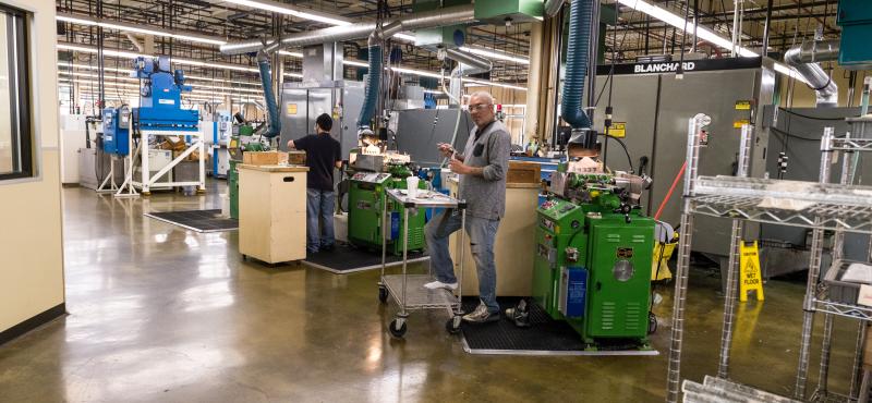 A QCC alumni works in a warehouse